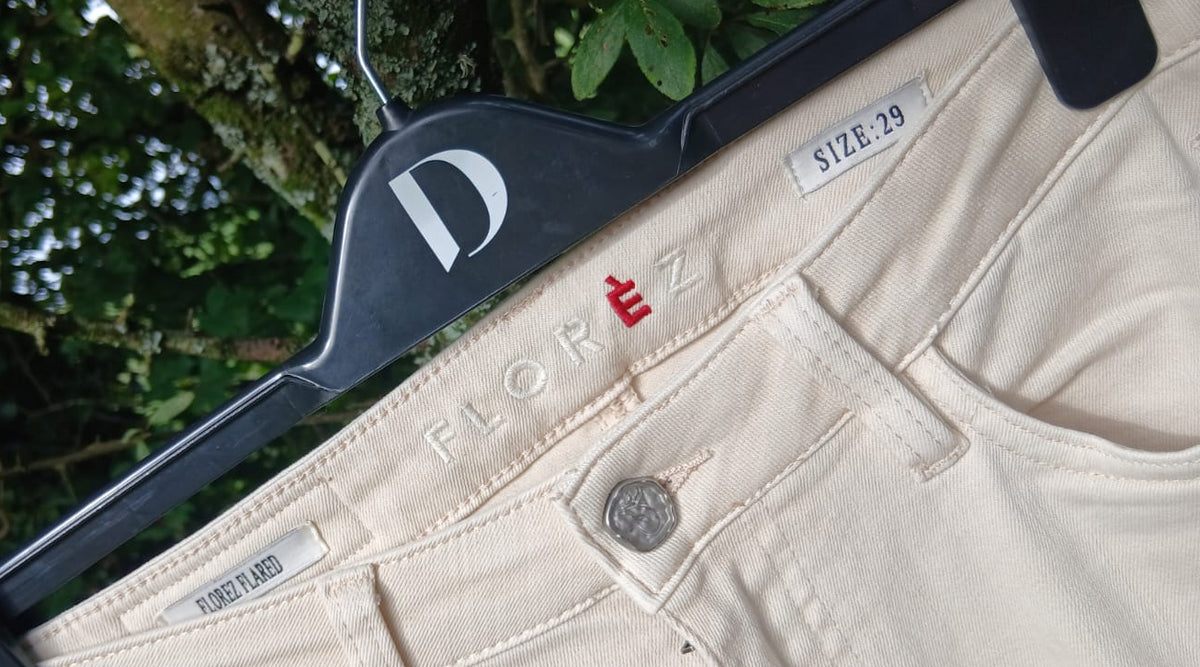 Beige denim jeans with the brand name 'Florez' visible.