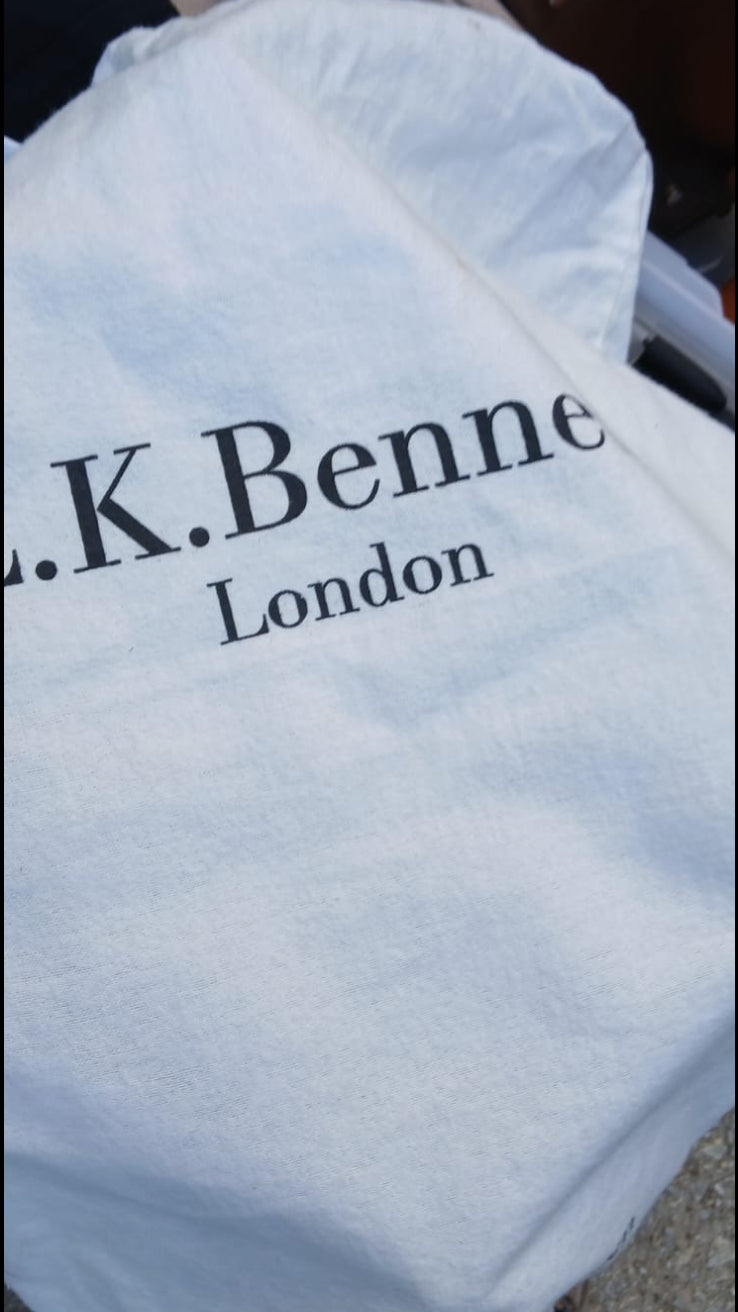 A white fabric dust bag with 'L.K.Bennett' inscription.