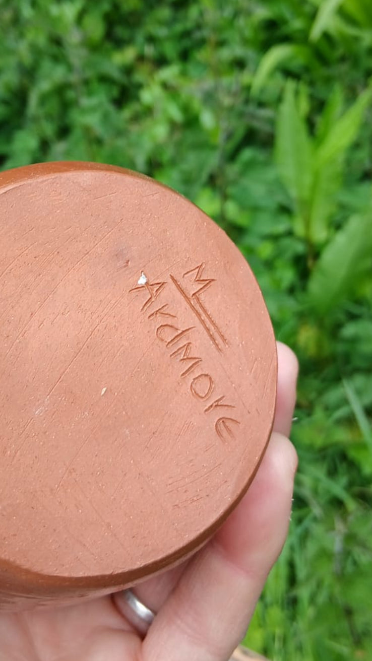 The bottom of a terracotta pot featuring the brand name 'Ardmore' engraved.