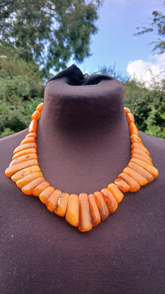A honey-butterscotch orange chunky beaded necklace made of baltic amber.