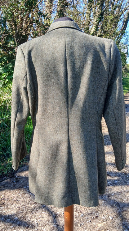 Back view of Derby House green tweed jacket