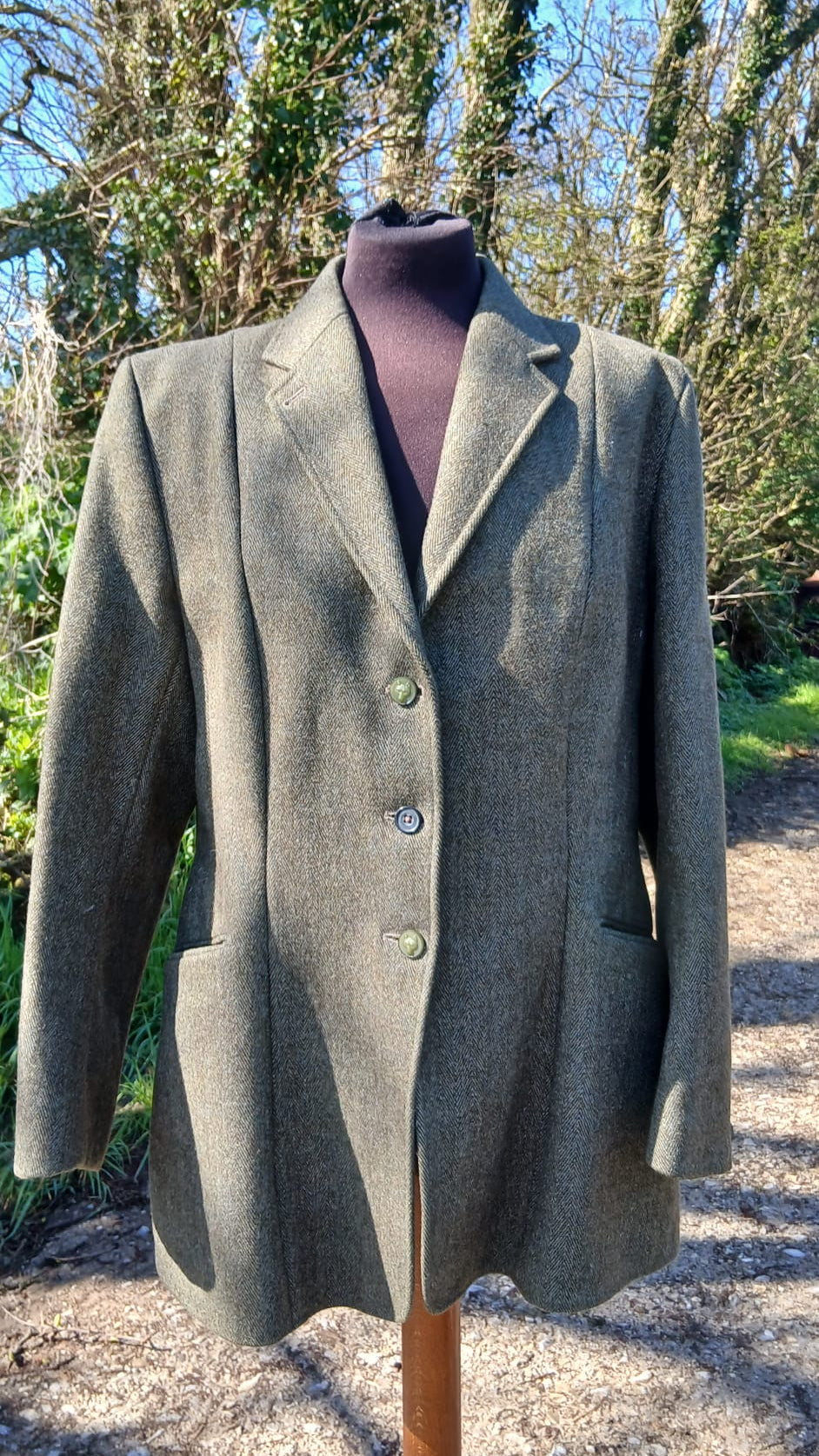 Front view of Derby House green tweed jacket