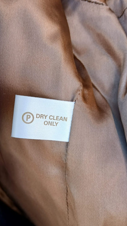 Care tag of Derby House green tweed jacket
