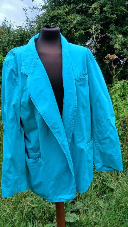 A bright turquoise blue jacket by Mustang clothing.
