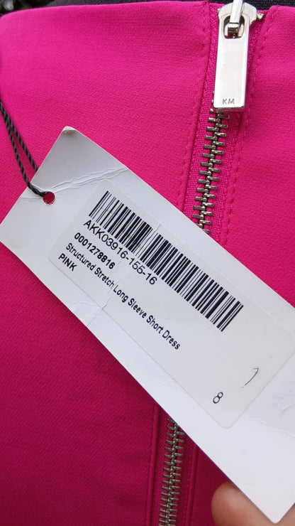 Close-up of a Karen Miller pink dress tag information