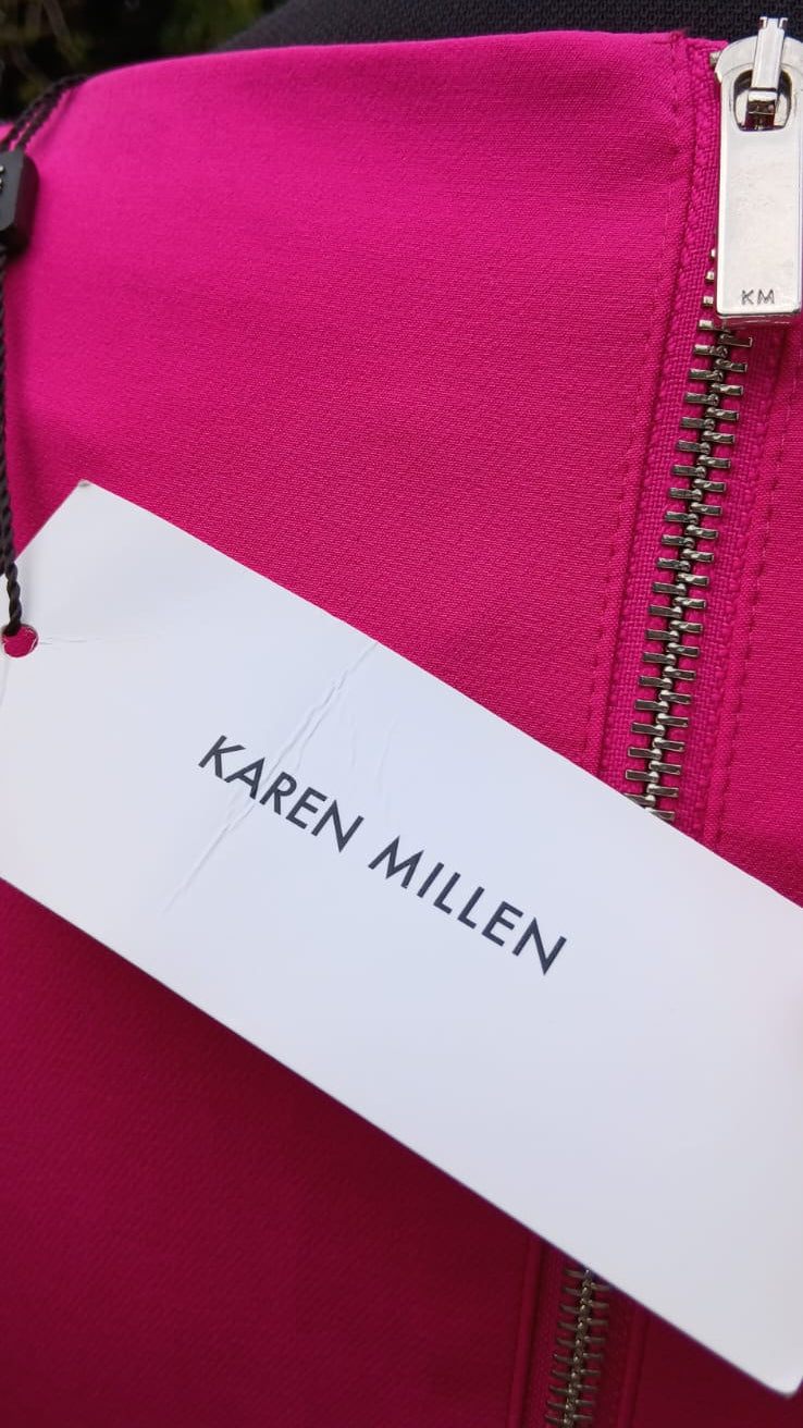 Close up of the original tag of a Karen Miller pink dress