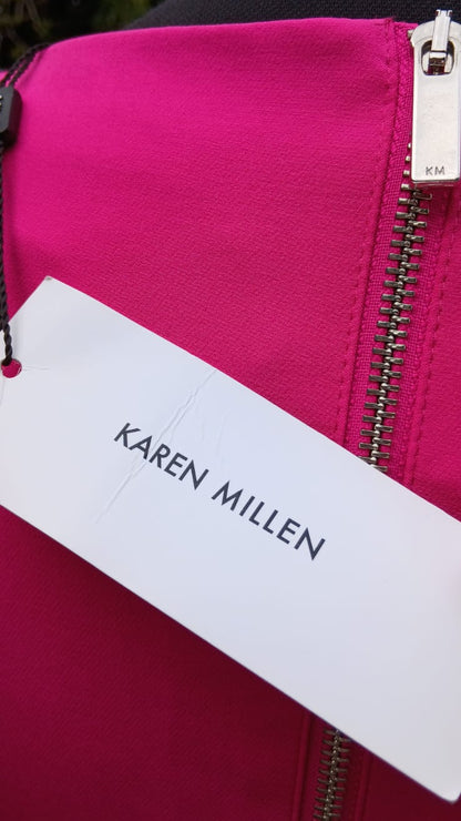 Close up of the original tag of a Karen Miller pink dress