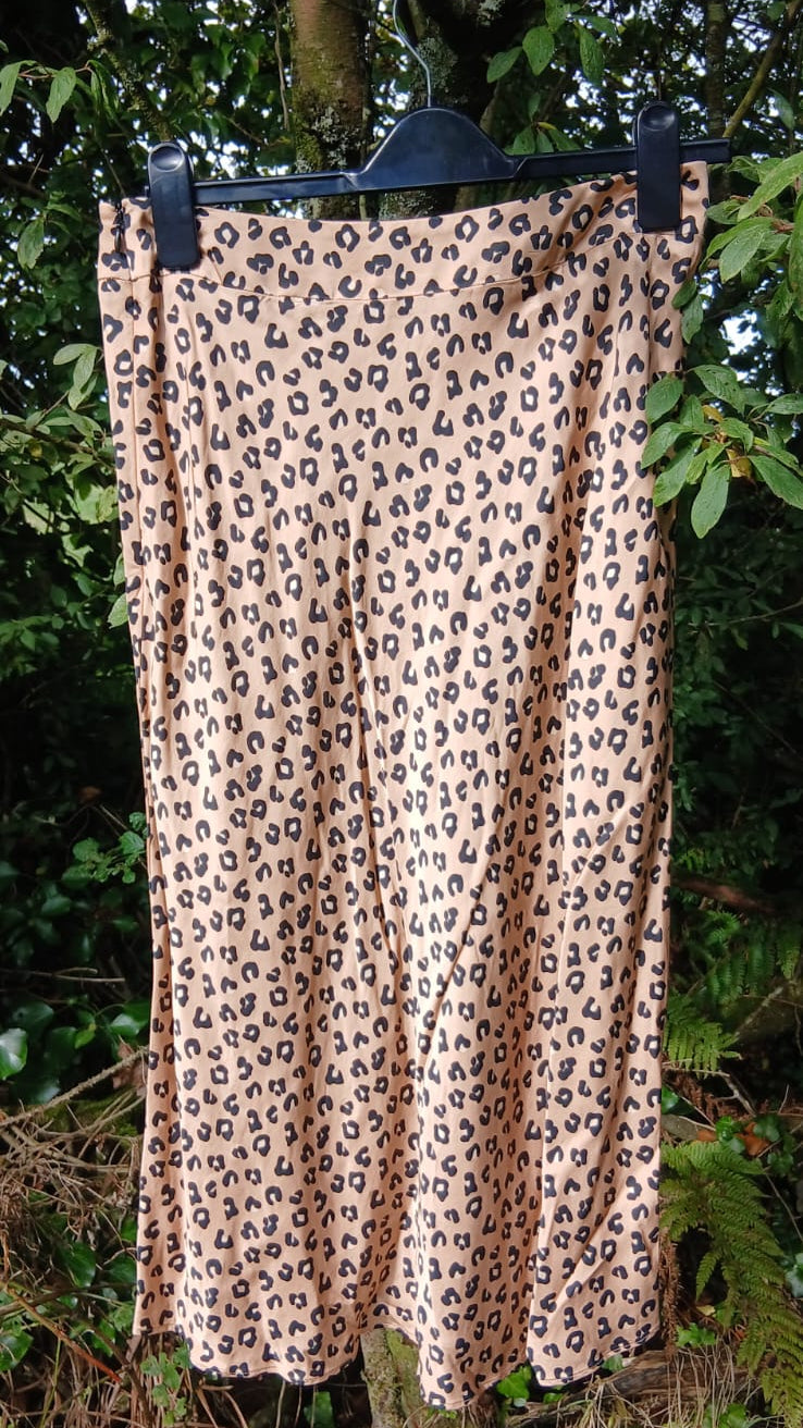 A Sézane leopard print midi skirt in beige and brown.