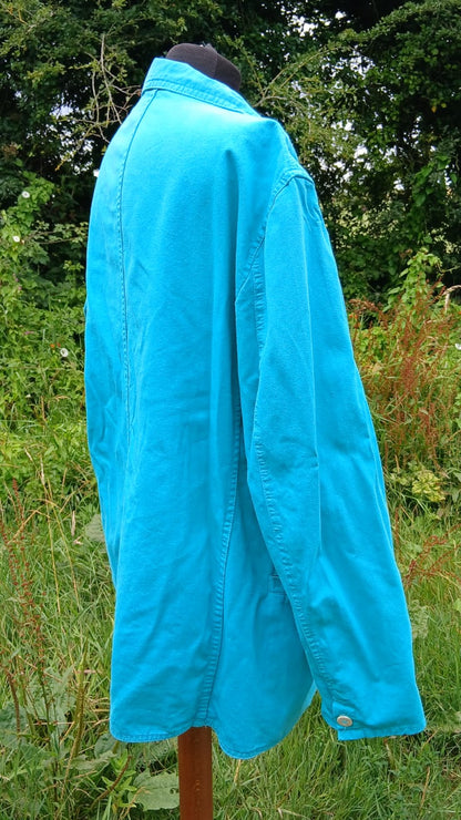 A bright turquoise blue long-sleeve shirt jacket by Mustang clothing.