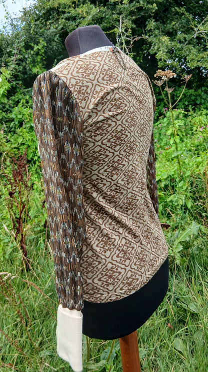 A long-sleeve patterned top by Angels Never Dies.