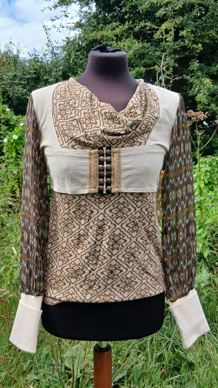 A Boho patterned long-sleeve top, with a cream waist panel and cuffs by Angels Never Dies.