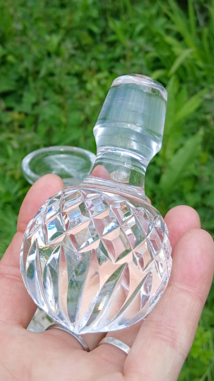 Cut crystal decanter stopper with diamond pattern.