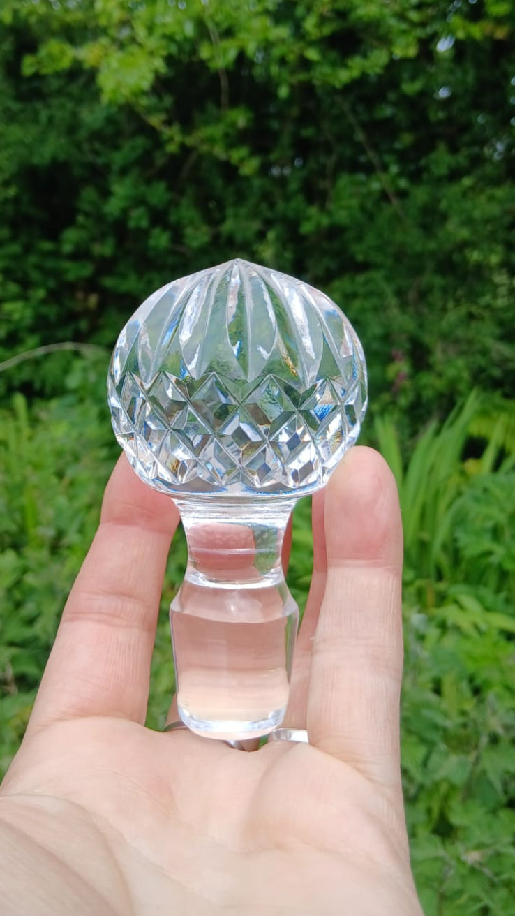 Close up view of the solid glass stopper with diamond pattern.