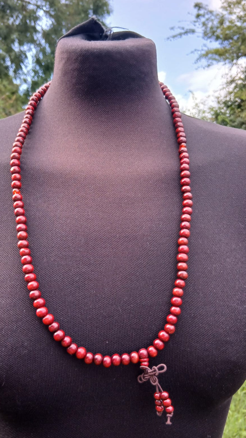 An antique red beaded mala prayer necklace. 