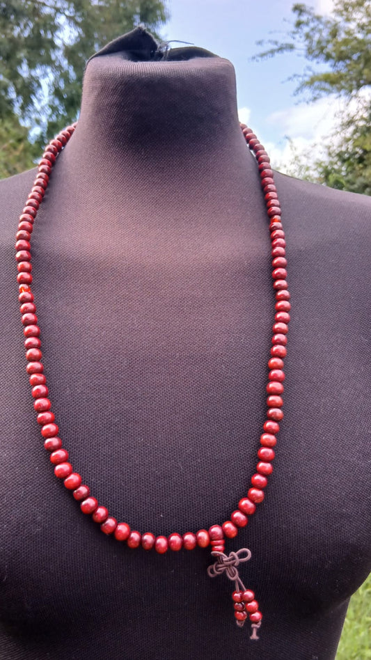 An antique red beaded mala prayer necklace. 