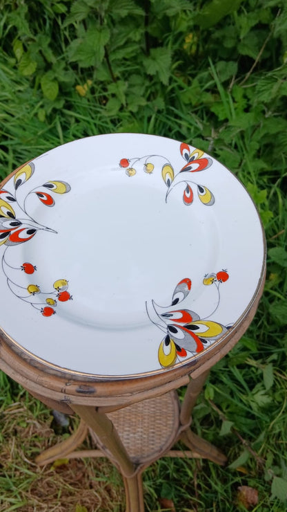 An Art deco, Wetley China white bone-china porcelain, side plate from a trio with a colorful floral and berries hand painted pattern.