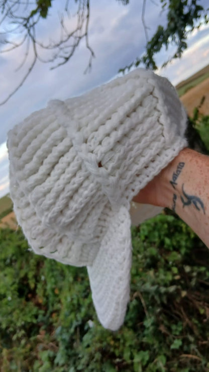 A white crocheted baseball cap.