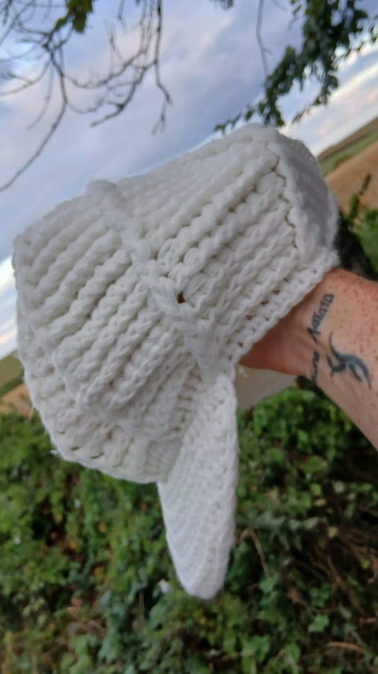 A white crocheted baseball cap.
